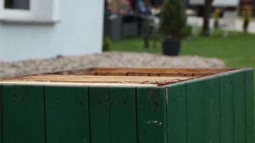 Beekeeper Putting Wax Frames in to hive bodies