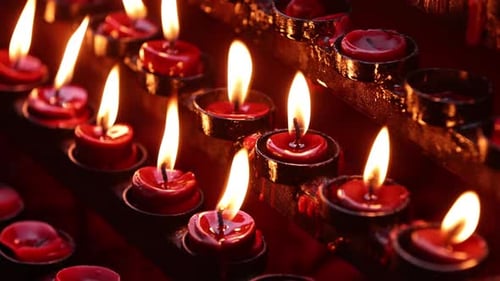 Rows of candles in a church or temple.