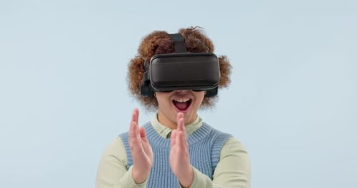 Enthusiastic Young Adult Interacting with Virtual Reality Headset