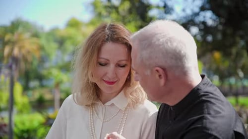Loving Couple Sharing Intimate Moments in Lush Park
