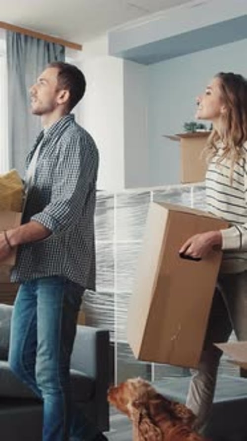 Happy Couple Moving Into New Apartment Together