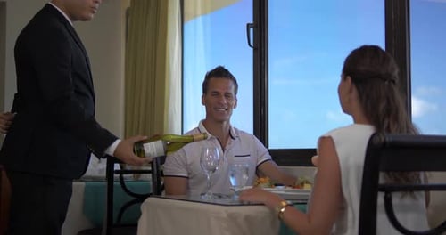 Palm Beach, Noord / Aruba - June 20 2016: Waiter Pours Wine
