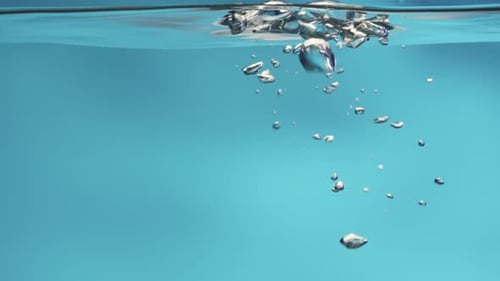 Air Bubbles Rising in Blue Underwater Environment
