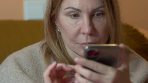 Woman Using Smartphone in Home Close Up