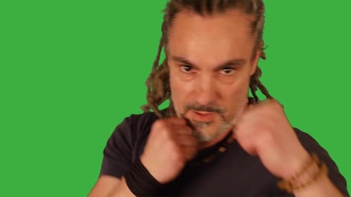 Male Fighter Doing Fight Boxing Practice Training Isolated on Green Screen
