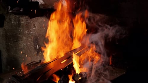 Burning Fire in Furnace at Forge Workshop Blacksmith Equipment Concept