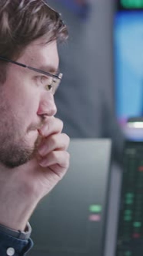 Stock Traders Work on Computer with Realtime Stocks