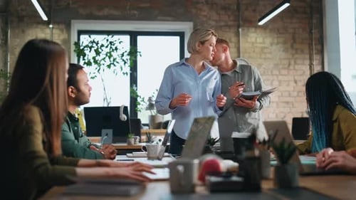 Woman Ceo Leading Business Meeting with Young Creative Team in Office Boardroom