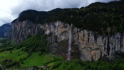 4k Drone Aerial Of Famous Staubbach Waterfall In Lauterbrunnen Village With Impressive Glacial Valle