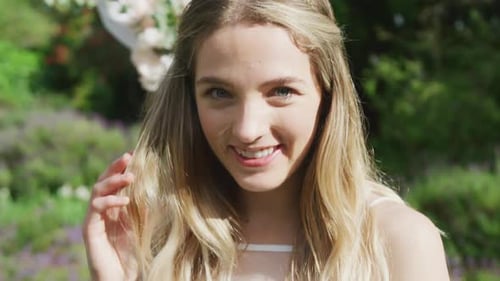 Beautiful Woman Smiling in Summer Garden