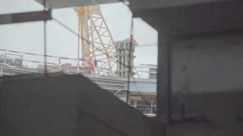 Labourers Install Concrete Detail on Top of Future Stadium