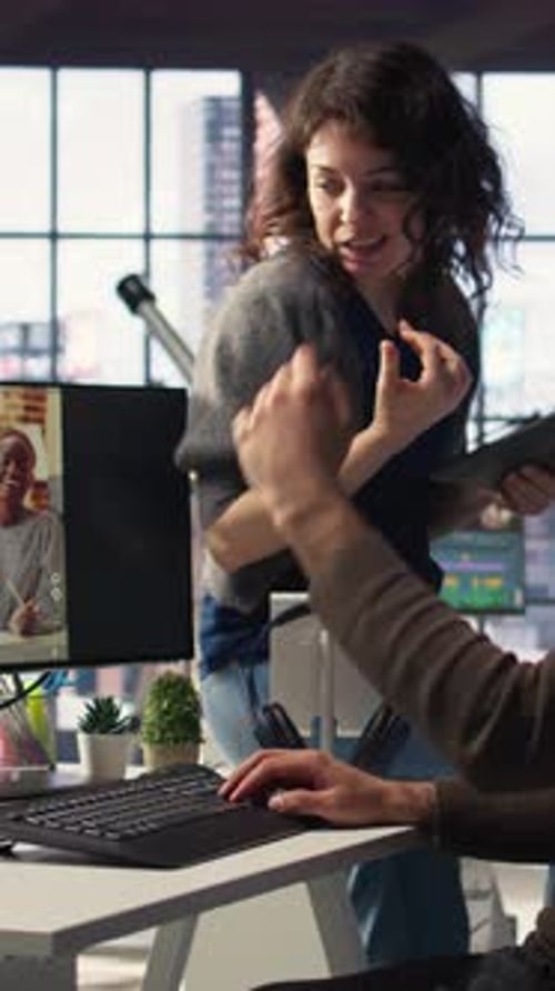 Vertical Video Man and Woman Collaborate on Content Creation for the Media Industry