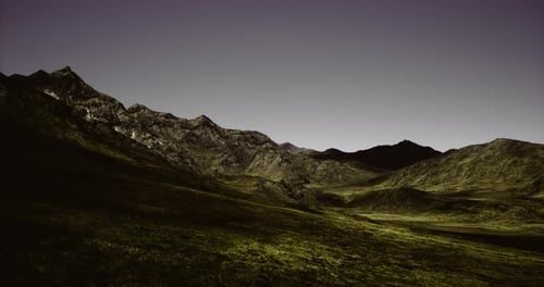 Majestic Mountains Rise Above a Serene Valley Under a Twilight Sky