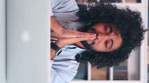 Young Adult Man Concentrates in Home Office