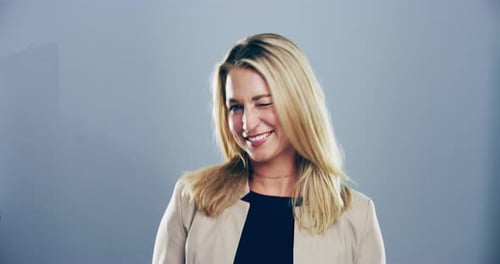 Smiling Woman with Blonde Hair Looking at Camera