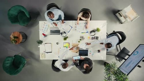 Top Down View of Employees Consulting with Executive Management