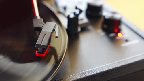 Closeup of Record Player Needle Tracking Vinyl Grooves During Playback Analog Sound Detail Capturing