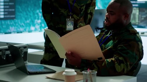 Angry Army Expert in a Command Post Power Base Monitors Satellite Footage