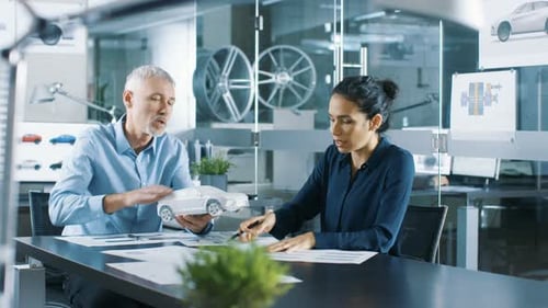 Experienced Automotive Designer and Female Engineer Works with a Concept Car Model Prototype, Perfe