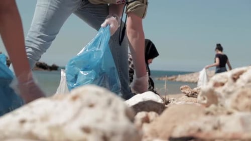 Volunteers Clean Up Rubbish On A Polluted Beach In Byblos, Lebanon.