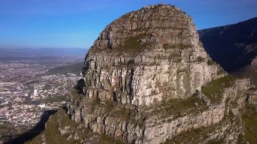 Fantastic Close Up Aerial Pullback of Lions Head Mountain Apex near Sea Point in Cape Town South Afr