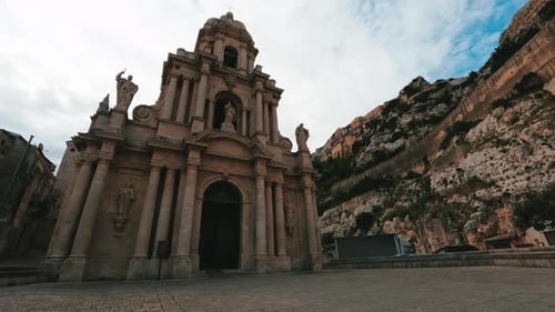 Baroque Church Facade Under Cloudy Sky