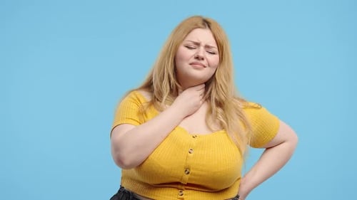 Plus Size Woman Has Sore Sick Lady With Swollen Throat On Blue Studio Angina