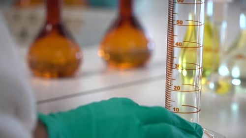 Close up shot Scientist fill test tube with liquid, Laboratory environment