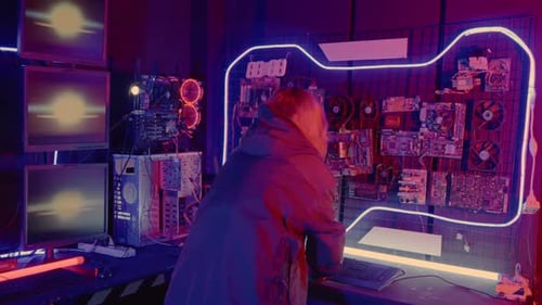Asian Woman Wearing a Black Jacket Hacking Programming System Check Hacking Hardware Circuit in Dark
