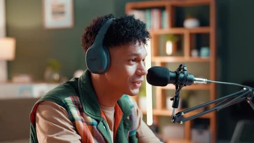 Influencer, microphone and talking with man in recording studio for content creator