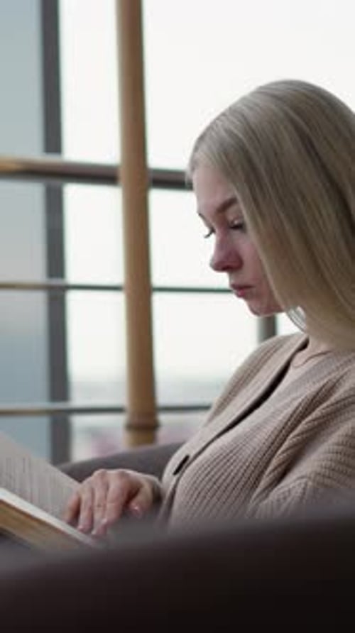 Side View of Lady Deeply Studying and Focusing on Reading From Open Book