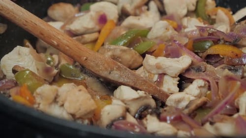 Chicken and Vegetables Sizzle in a Pan
