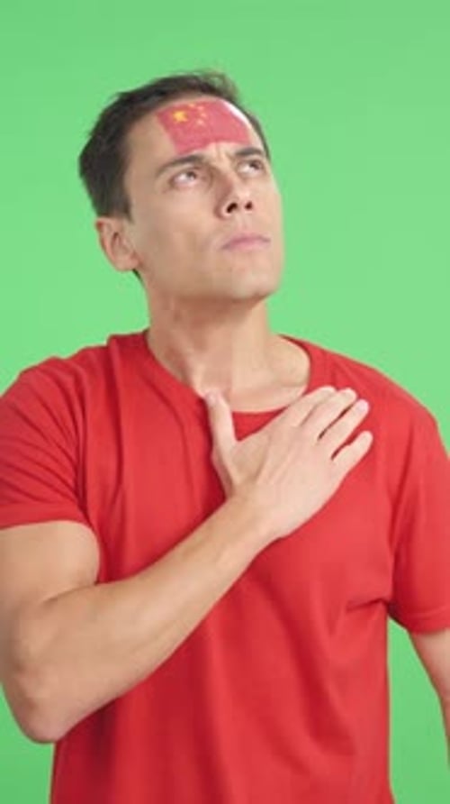 Man Listening to the China National Anthem with Solemnity