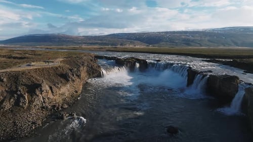 Aerial View of the Powerful Godafoss Waterfall on a Sunny Day in Northern Iceland