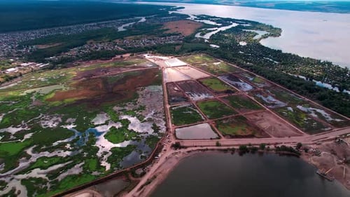 Geometrical Silt Grounds Near Sand Quarry on River Bank