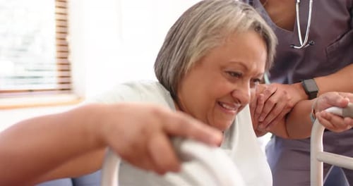 Senior Woman Walking with Support and Walker