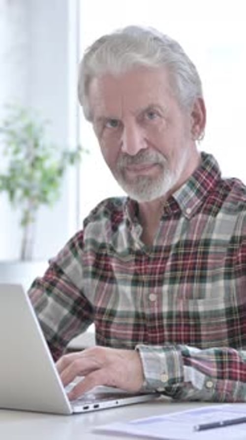 Ambitious Casual Old Man doing Thumbs Up in Office, vertical video