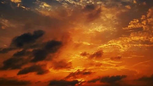 Dramatic Sunset with Vibrant Colors and Dark Clouds
