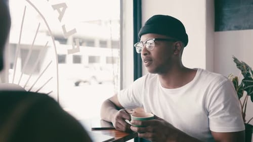 Friends, talking and men by coffee shop window for bonding, discussion and chatting together