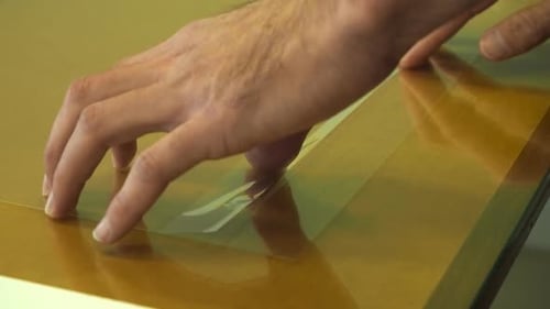 Art creating Acrylic prints of photographs in studio for artist wall art.