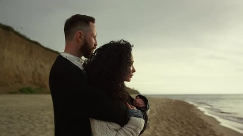 Beautiful Lovers Hugging on Sea Beach Shoreline. Couple Enjoying Nature Ocean View
