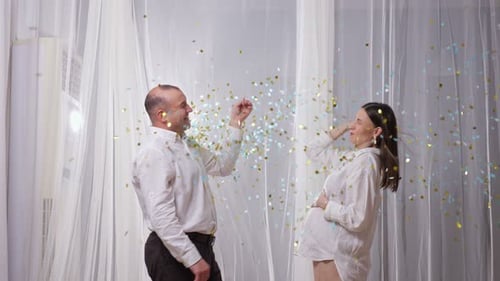 Expectant Couple Reveals Baby Gender with Confetti