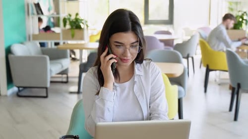 Portrait of Happy Young Office Assistant Working Remotely Online Sitting with Laptop and Coffee