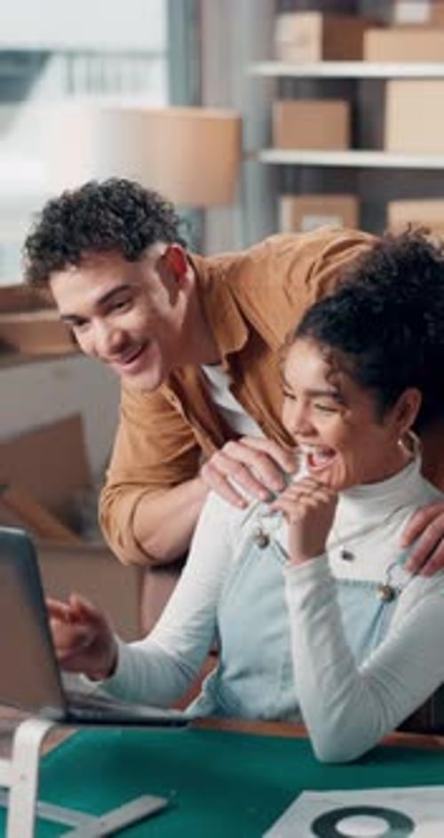 Small business, laptop and people with high five in warehouse for sales target