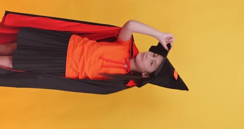 Girl Lying Down in Halloween Costume, Smiling
