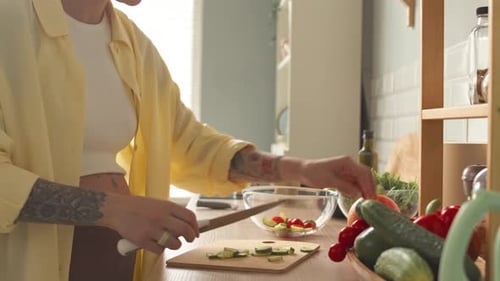 Woman Preparing Healthy Salad in Bright Kitchen