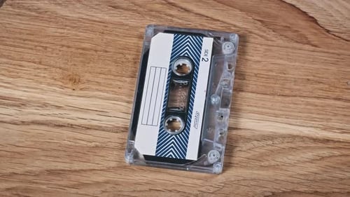 Audio Cassette On a Wooden Table