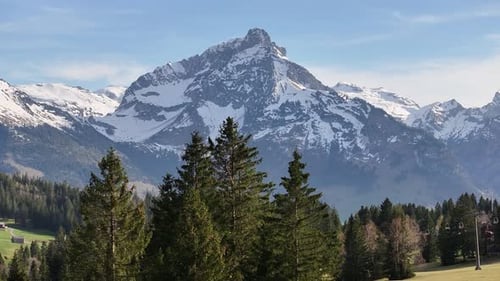 Alpine majesty: Amden Arvenbüel mountain peak in spring, Switzerland - aerial