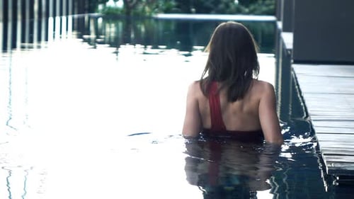 Woman Relaxing In Swimming Pool, Super Slow Motion 240fps