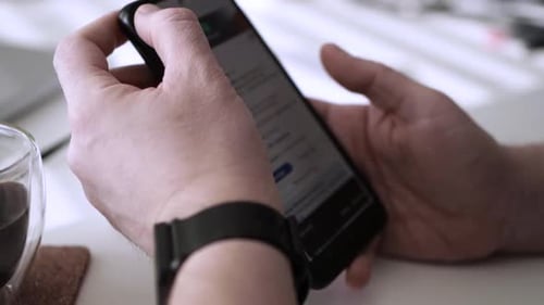 Man scrolling social media in smartphone